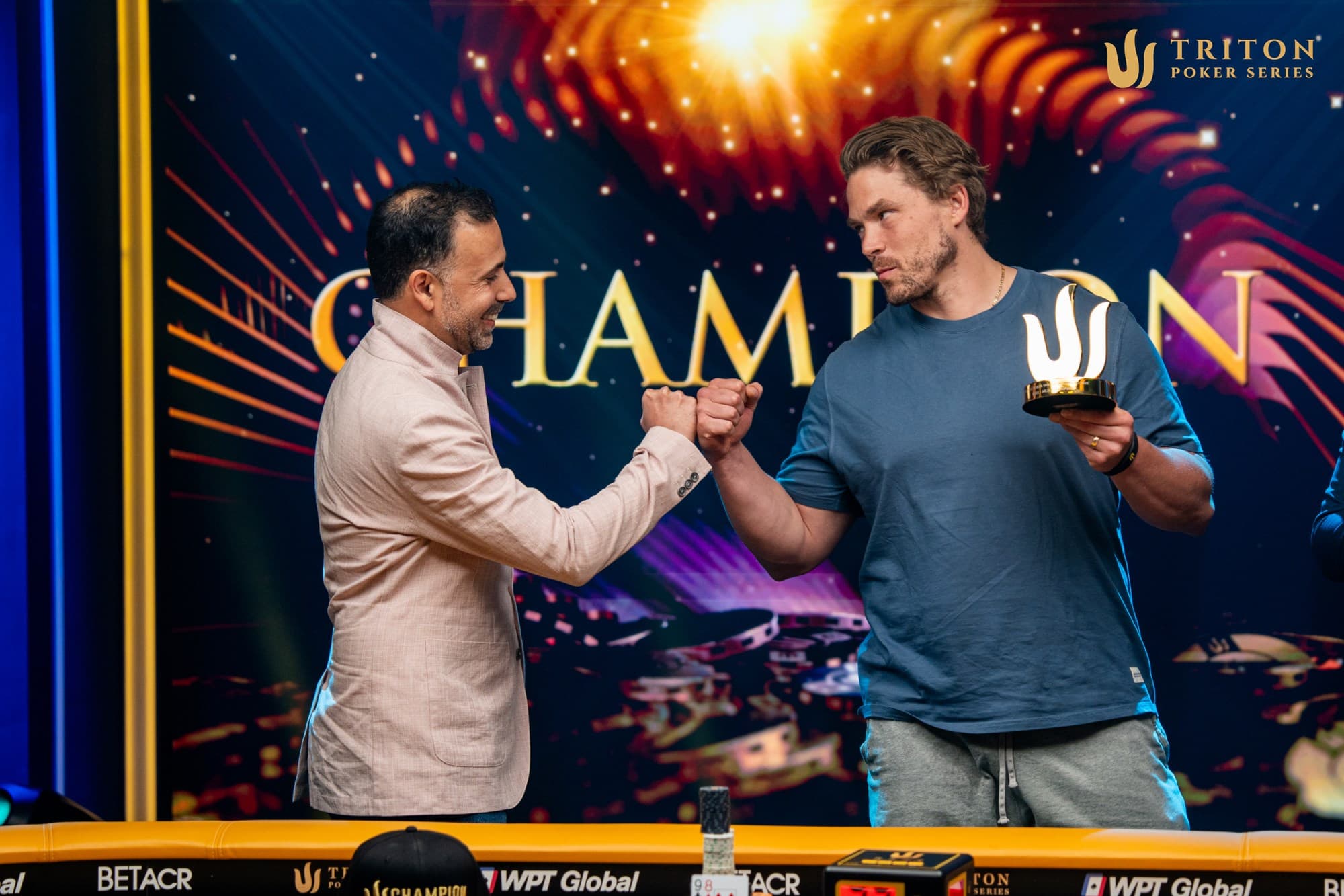 A winner's fist-bump from Ali Nejad for Alex Foxen