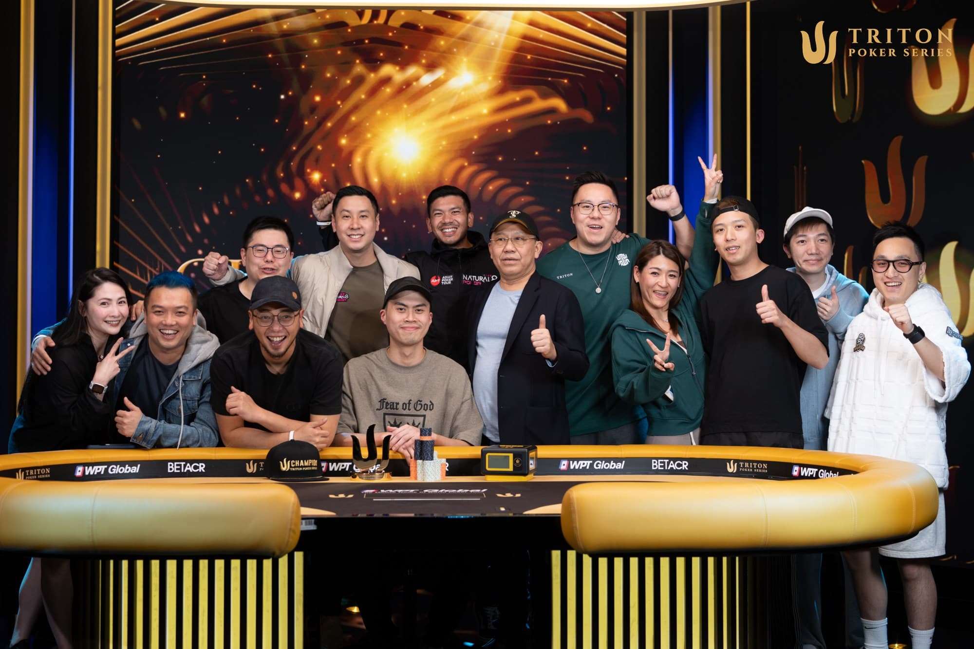 A stage full of superstars celebrates with Kiat Lee