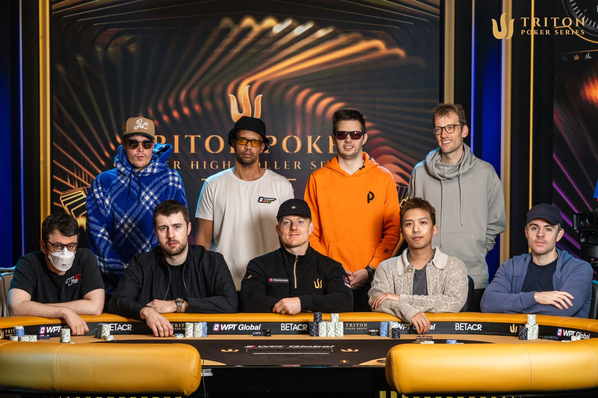 Event 12 final table players (clockwise from back left): Eelis Parssinen, Phil Ivey, Matthias Eibinger, Christoph Vogelsang, Ben Tollerene, Wayne Heung, Jason Koon, Wiktor Malinowski, Isaac Haxton.