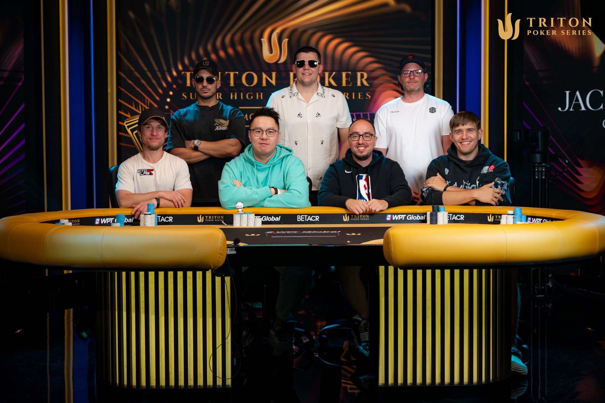 Triton Montenegro Event 5 final table players (clockwise from back left): Jamil Wakil, Jesse Lonis, Nick Petrangelo, Dominykas Mikolaitis, Barak Wisbrod, Danny Tang, Dan Dvoress