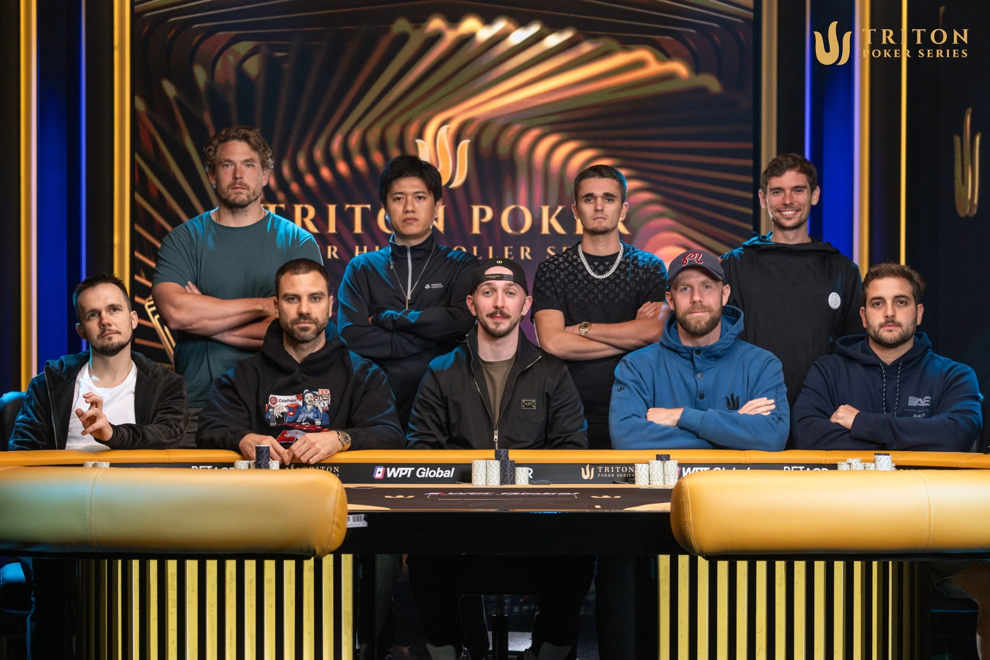 Triton Montenegro Event 6 final table players (clockwise from back left): Alex Foxen, Poseidon Ho, Jules Dickerson, Fedor Holz, Joao Simao, Seth Davies, Matthew Belcher, Danilo Velasevic, Mikita Badziakouski