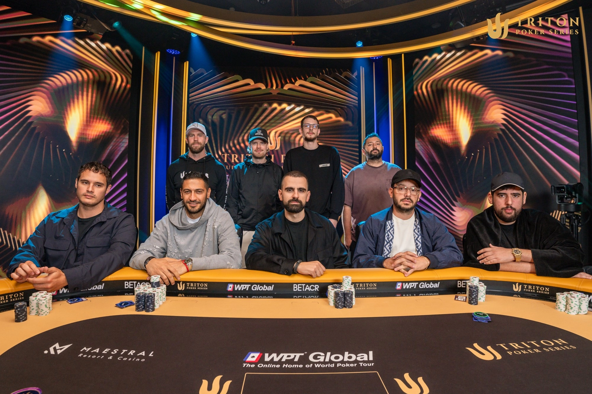 Triton Invitational final table players (clockwise from back left): Seth Davies, Joni Joukhimainen, Thomas Santerne, Ramin Hajiyev, Maher Nouira, Eric Wasserson, Aleksa Pavicevic, Javid Ismayilov, Taylor Von Kriegenbergh.