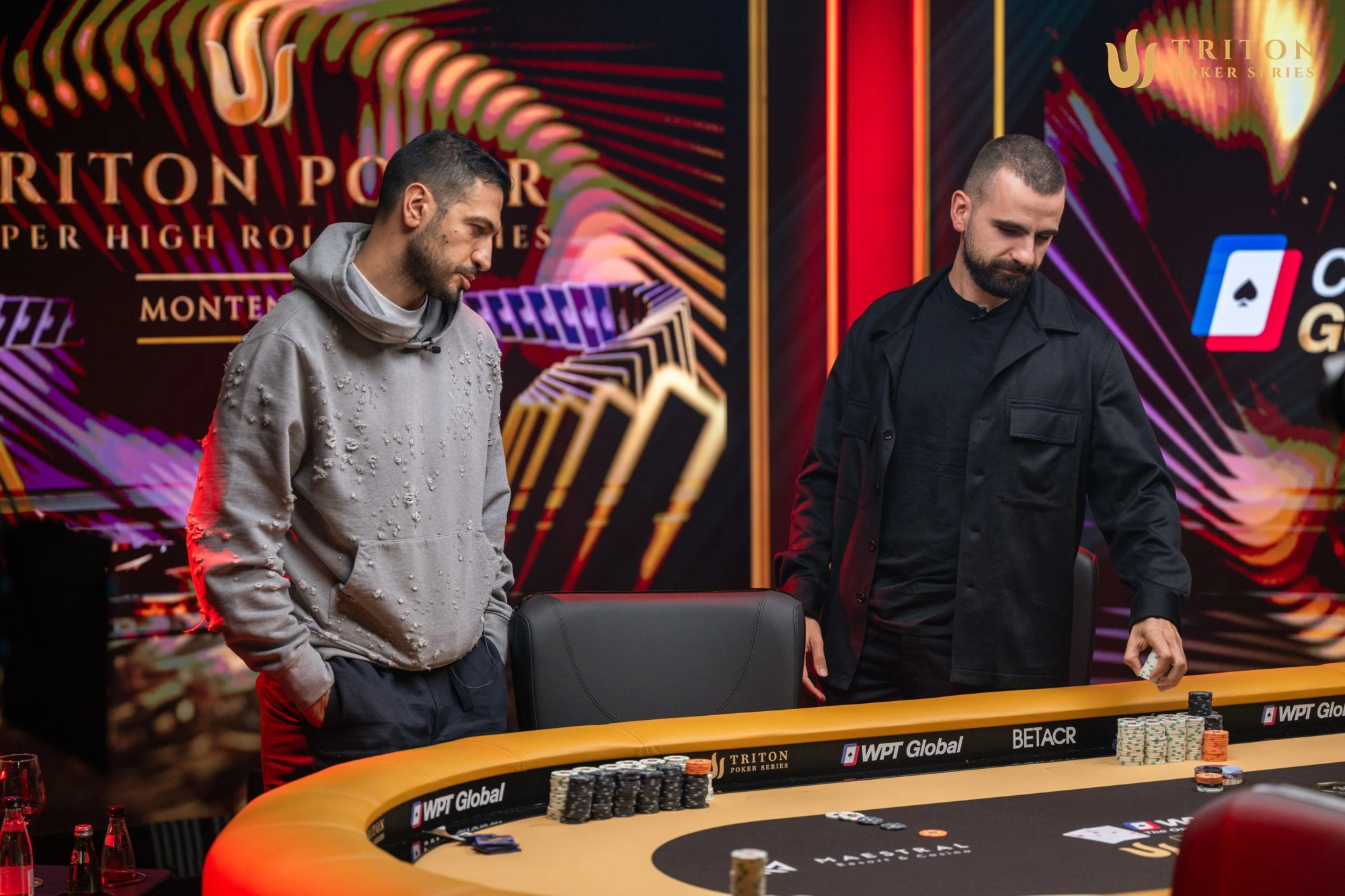 Javid Ismayilov, left, watches his aces cracked by kings