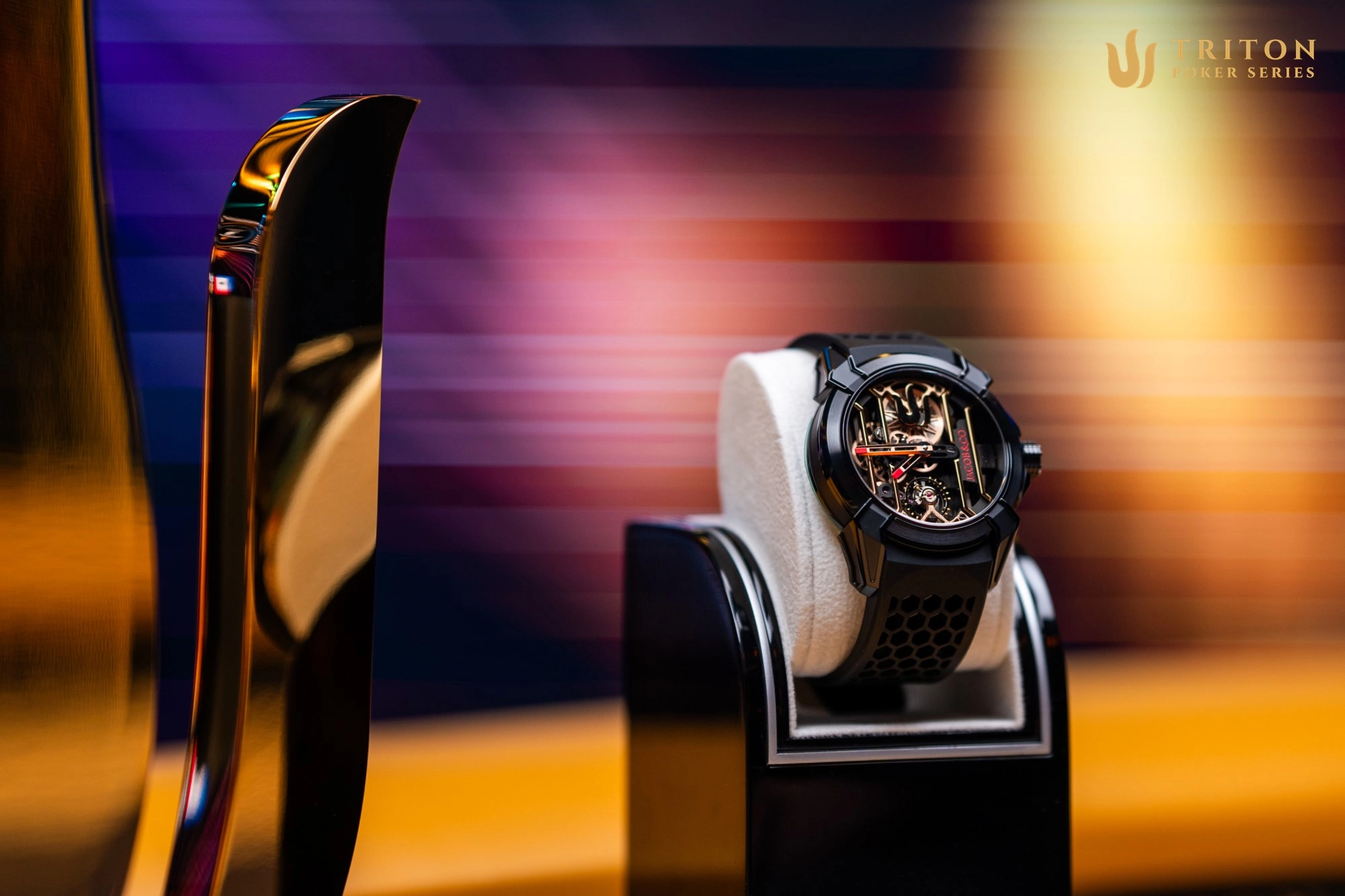 The Main Event trophy and watch